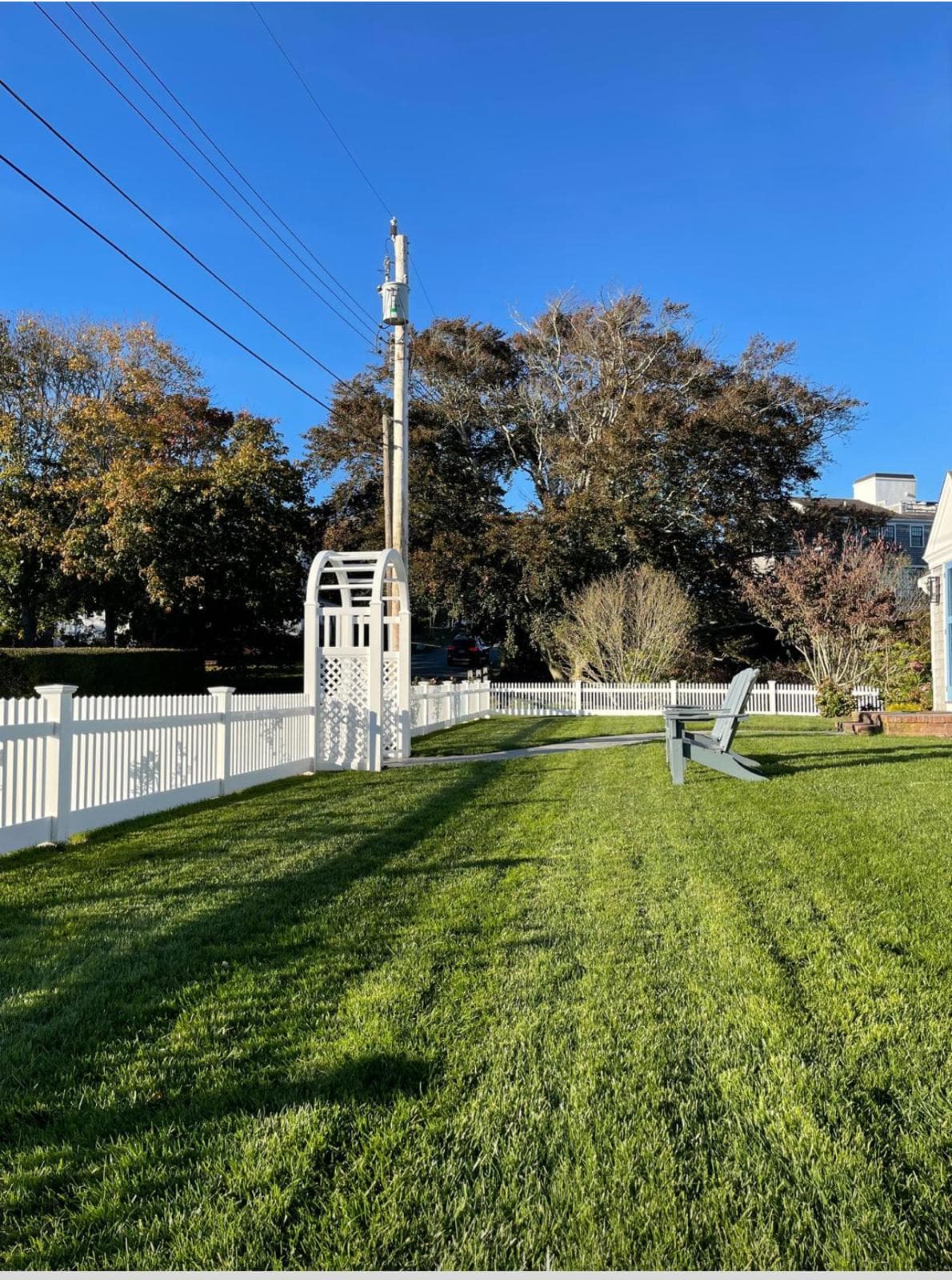 Ornamental aluminum fencing with decorative details at a residential entrance