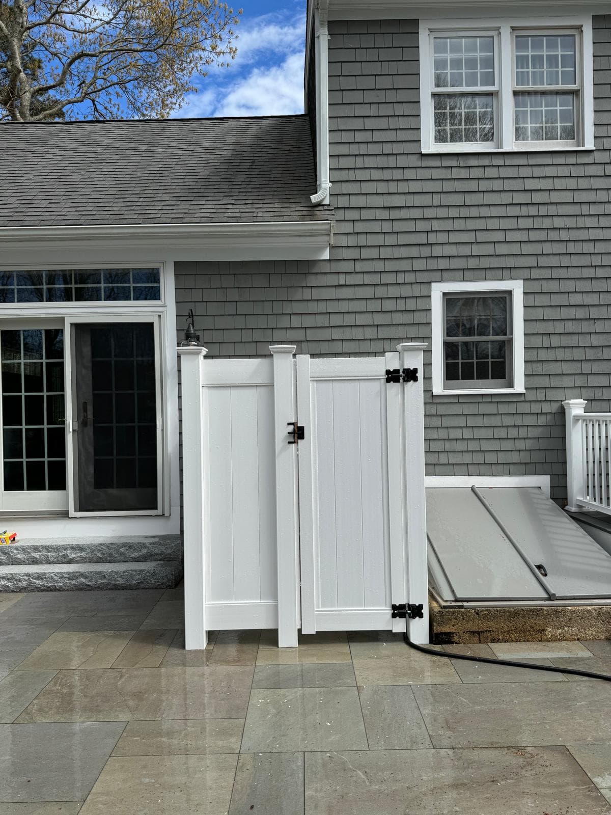 Flat-top aluminum fence with straight clean lines along a property perimeter
