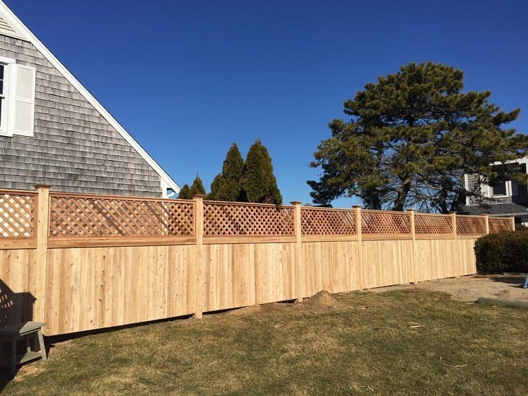 Quality wood fence craftsmanship and materials on a residential lot — JT Fence Inc.